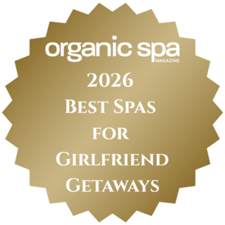 Gold seal featuring "organic spa MAGAZINE," highlighting the "2026 Best Spas for Girlfriend Getaways."
