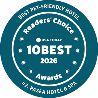 A teal badge featuring "Best Pet-Friendly Hotel," "Readers' Choice," and "#1. Paséa Hotel & Spa," highlighting the 2025 awards.